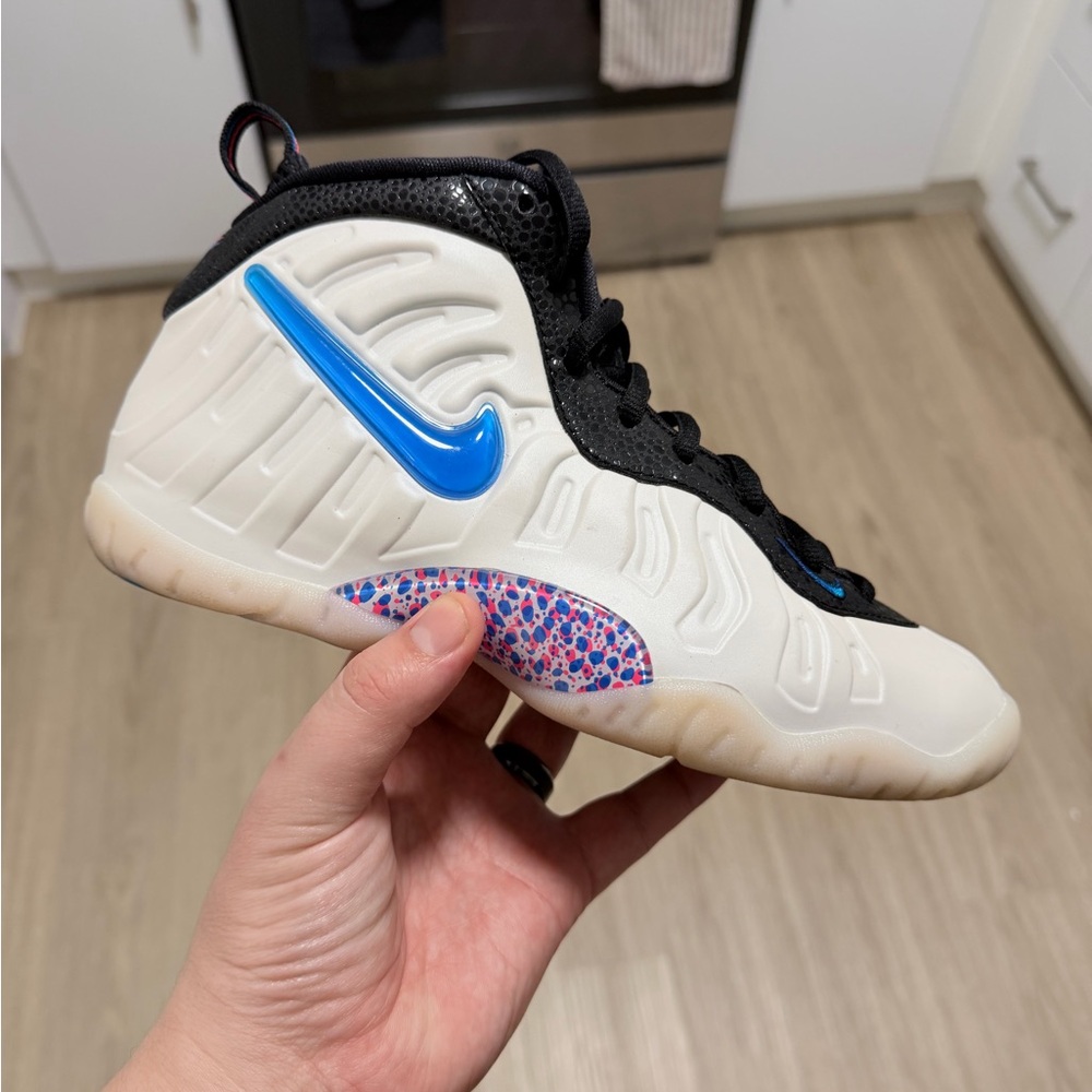 Nike Kids White and Black Foamposite with Blue Swoosh and Multicolor Speckle